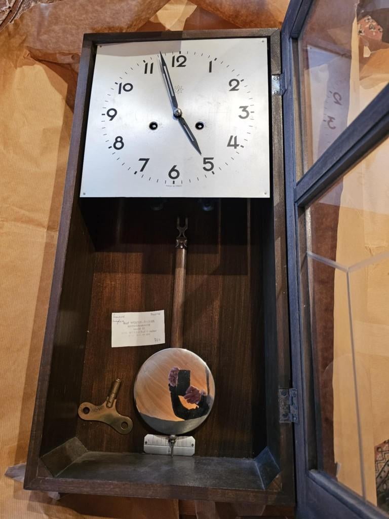 oude hangklok van het merk Junghans, Ophalen