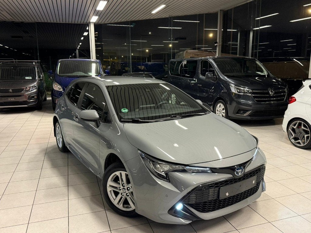 Toyota Corolla 1.8 Hybride/Benzine Automaat 72kW Euro 6d, Auto's, Toyota, Automaat, Lichtsensor, Euro 6, Corolla