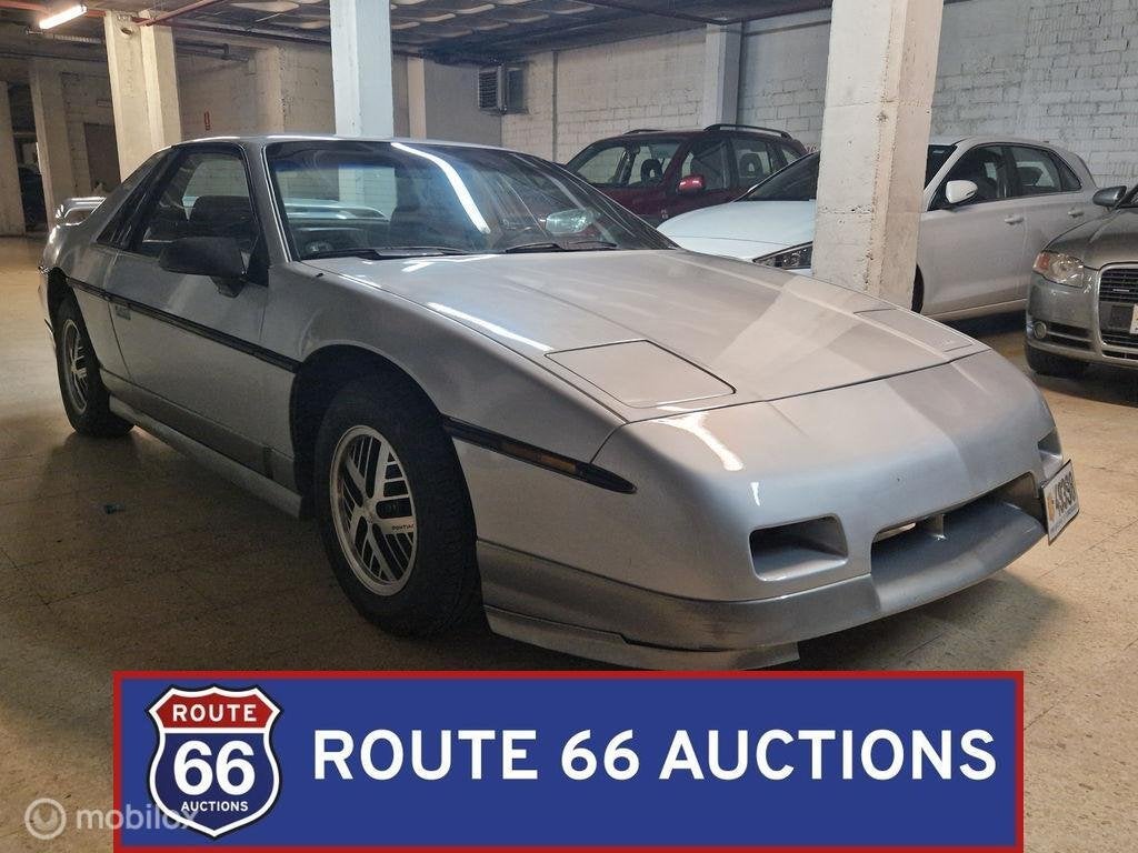 Pontiac Fiero | 1985 | Route 66 Auctions, Autos, Achat, Pontiac, Entreprise, Boîte manuelle