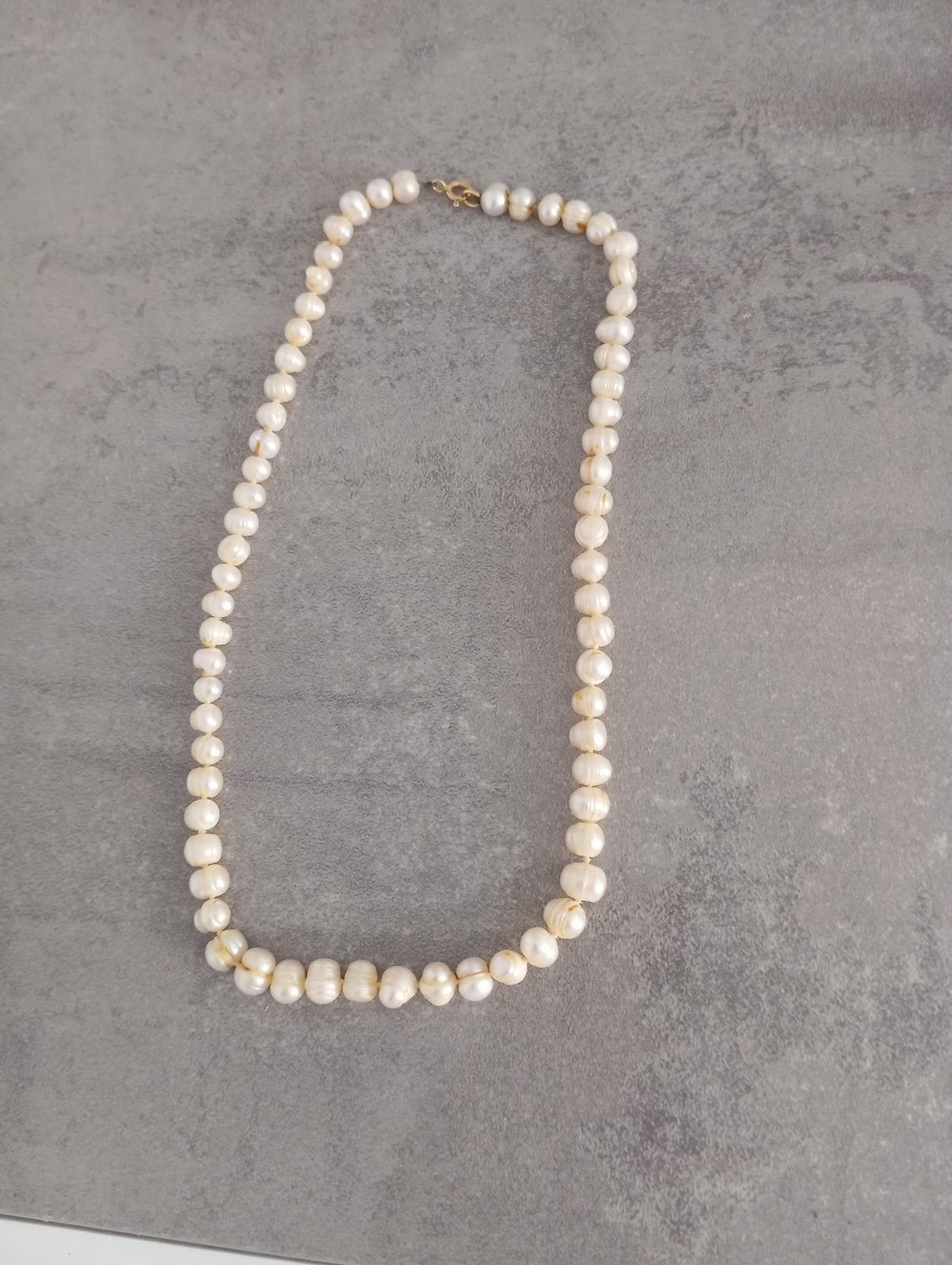 Parelketting, Ophalen, Goud