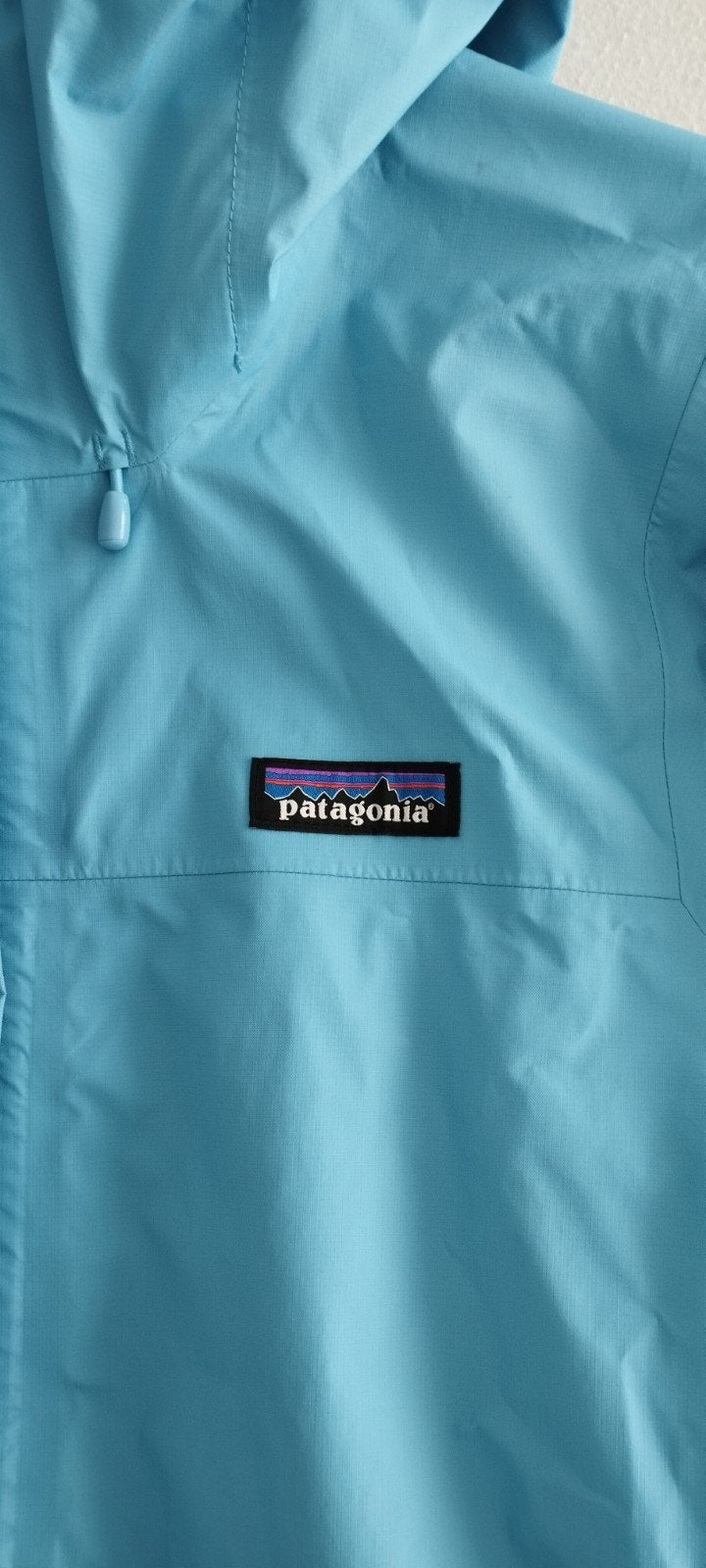 Waterdichte jas Patagonia, Ophalen