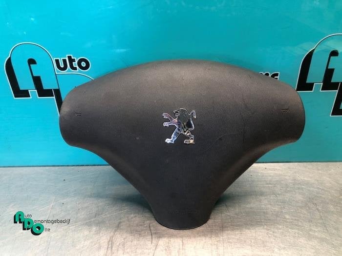 Airbag gauche (volant) d'un Peugeot 107 (107 05-), -, 3 mois de garantie, Utilisé, -