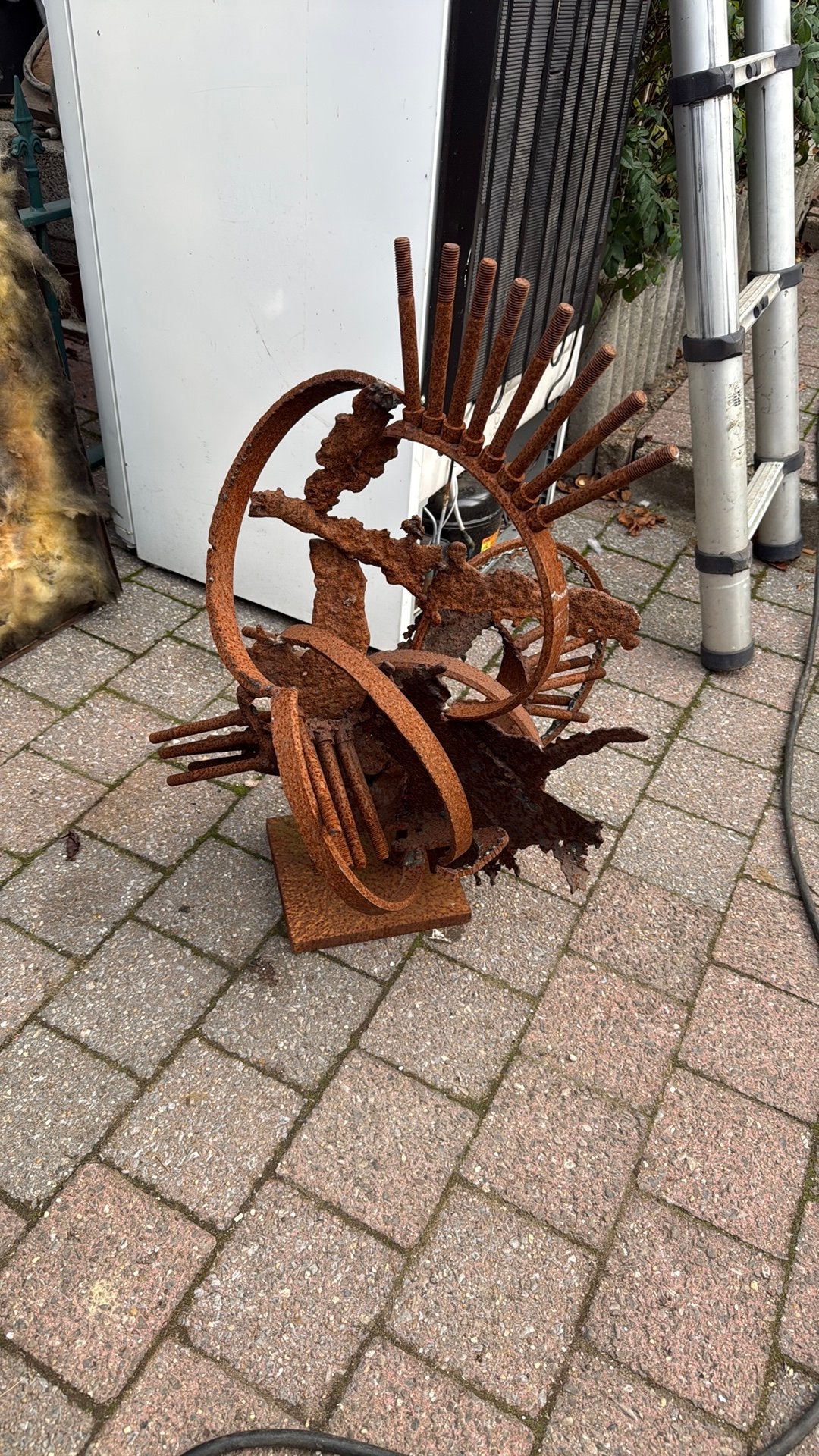 Kunstwerk in ijzer, Ophalen