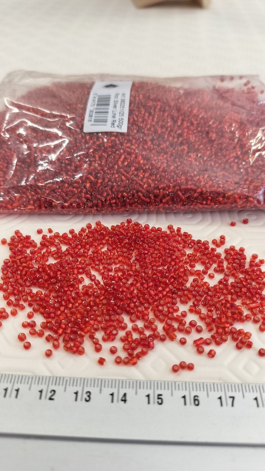 Sachet 500gr. Rocailles verre ~2mm Rouge silver line, Hobby en Vrije tijd, Ophalen of Verzenden, Nieuw, Kraal