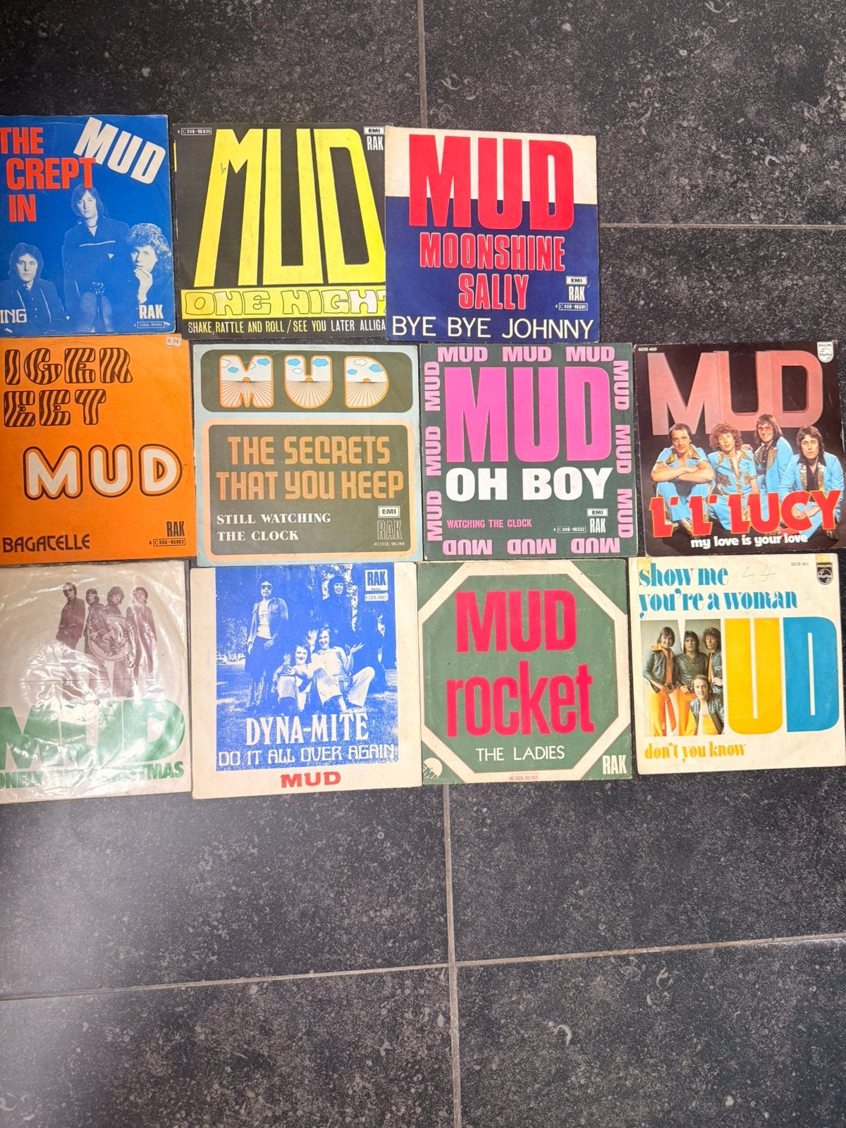 11 singles Mud, Ophalen, Zo goed als nieuw