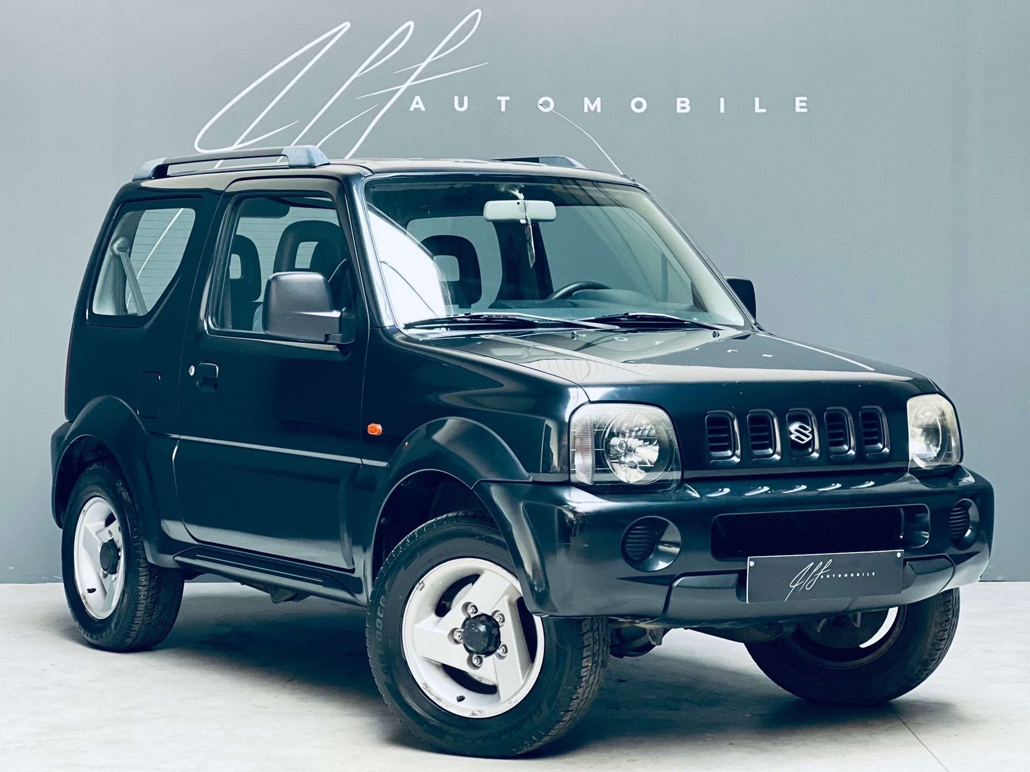 Suzuki Jimny 1.3i *4X4*CLIMATISATION*4 PLACES*GARANTIE*, Auto's, Suzuki, 4 zetels, Stof, Gebruikt, Zwart