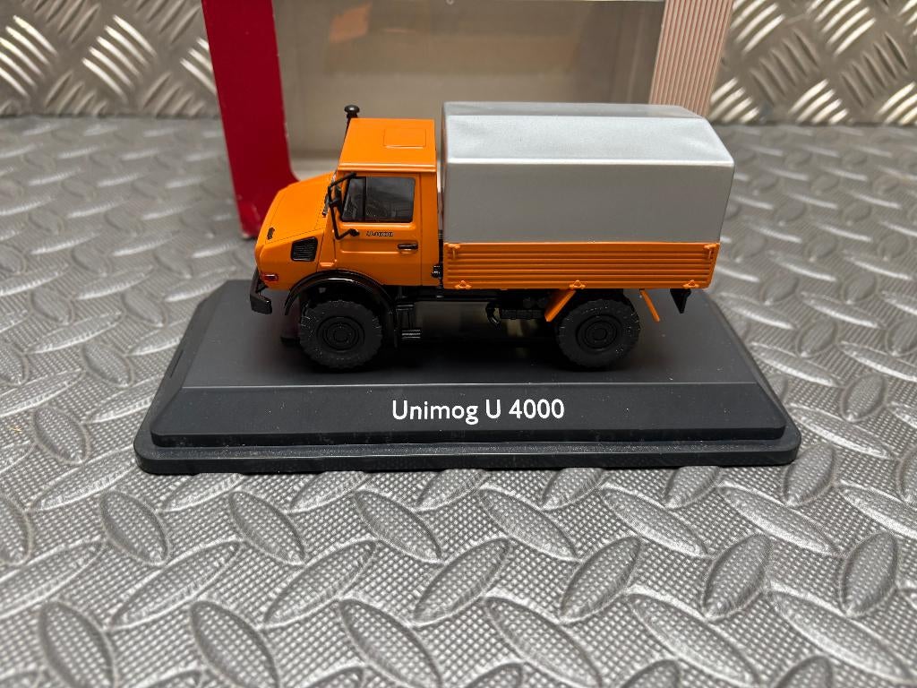 UNIMOG U 4000 MB oranje - NZG 1/43, Verzenden, Nieuw, Bus of Vrachtwagen, Overige merken