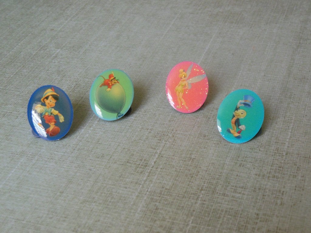 Disney pin/speldje - set van 4 st., Enlèvement ou Envoi, Peter Pan ou Pinocchio, Comme neuf, Autres types