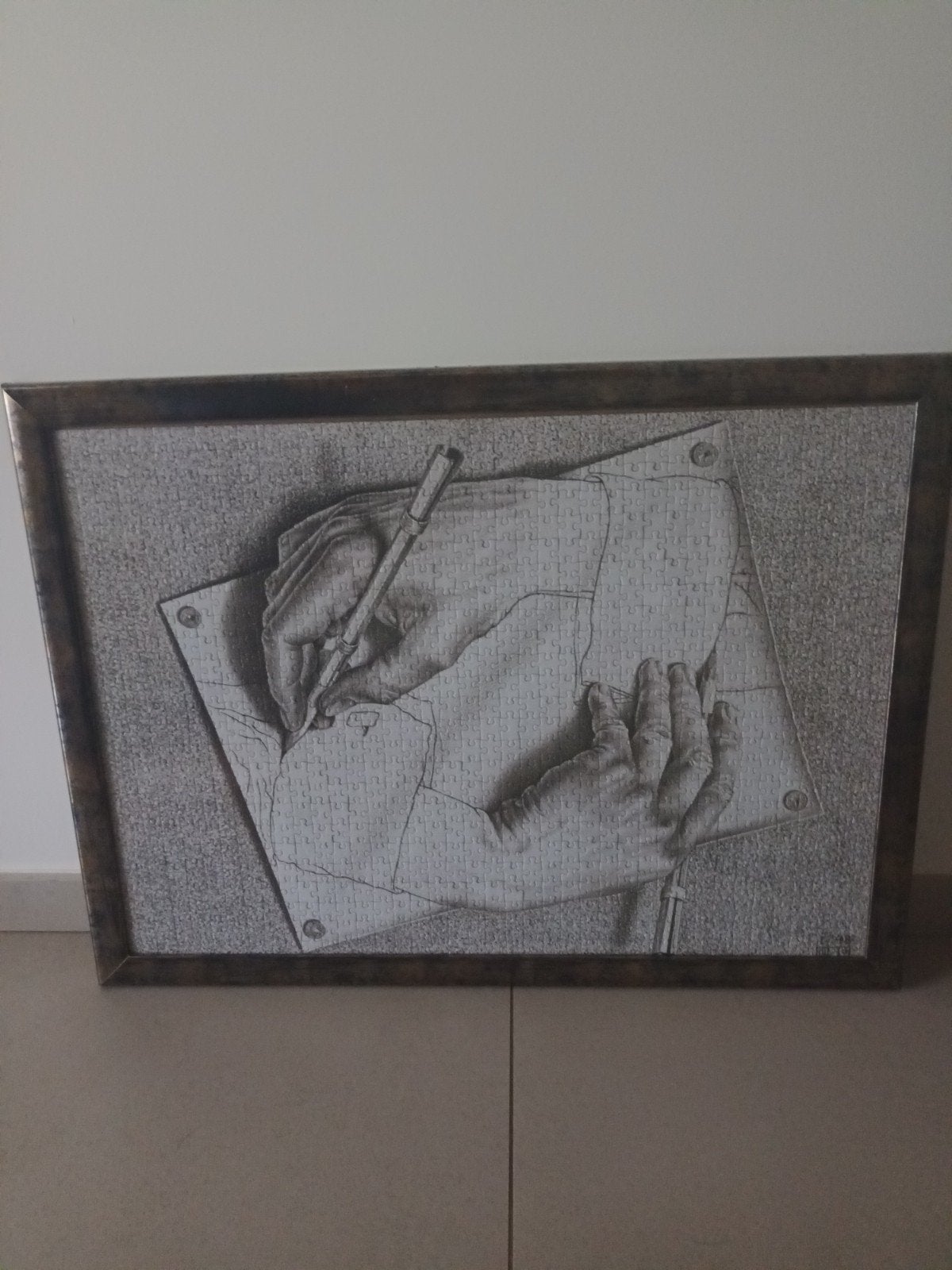 MC Escher puzzel met kader, Ophalen