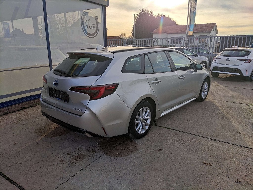 Toyota Corolla 1.8 Hybrid Touring/Automaat/Navi/Camera/Cc/Bt, Auto's, Automaat, Stof, Gebruikt, 72 kW
