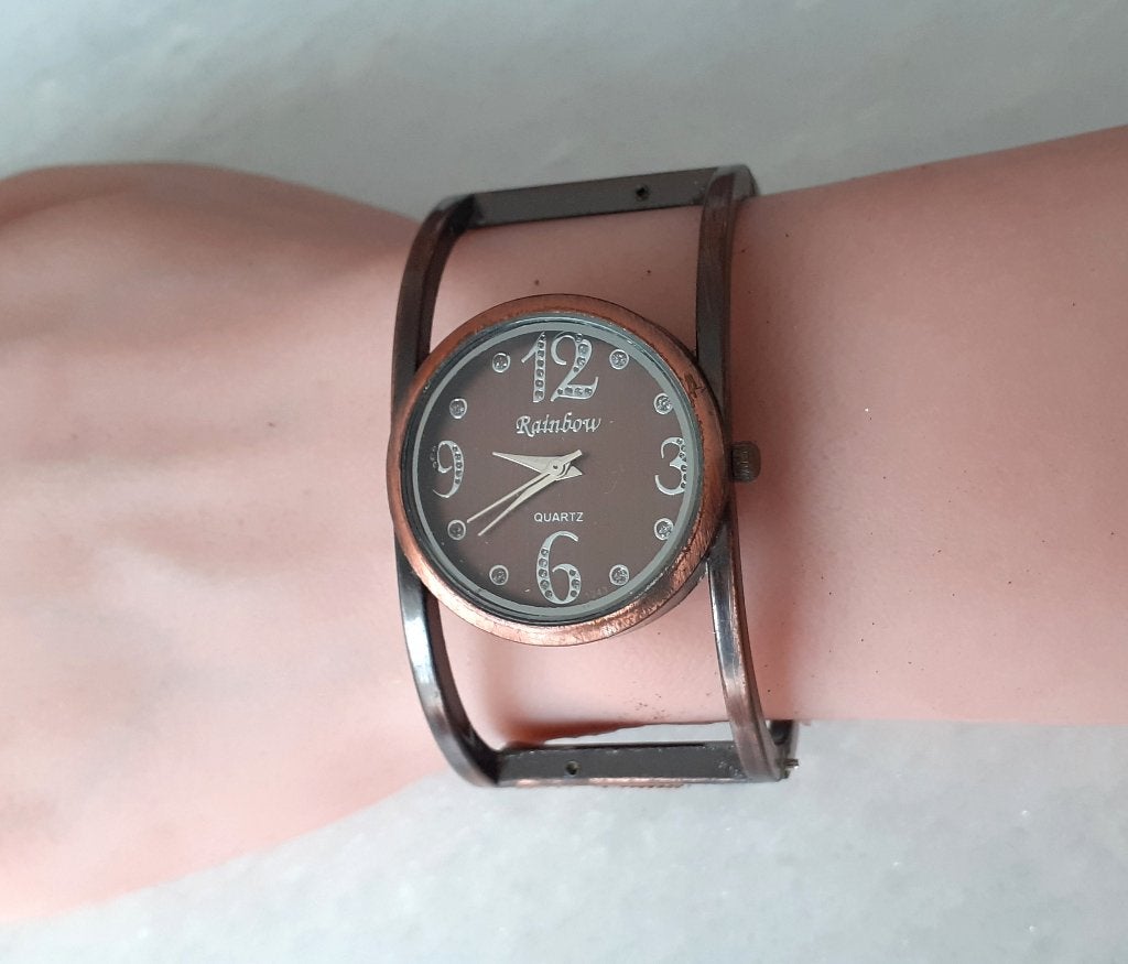 horloge dames koperkleurige cuff Rainbow, Handtassen en Accessoires, Horloges | Dames, Overige merken, Staal, Polshorloge, Overige materialen