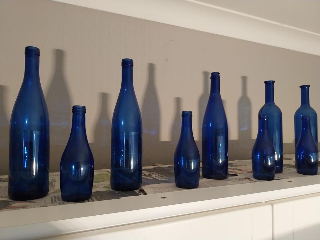 Blauwe flessen, Ophalen, Zo goed als nieuw