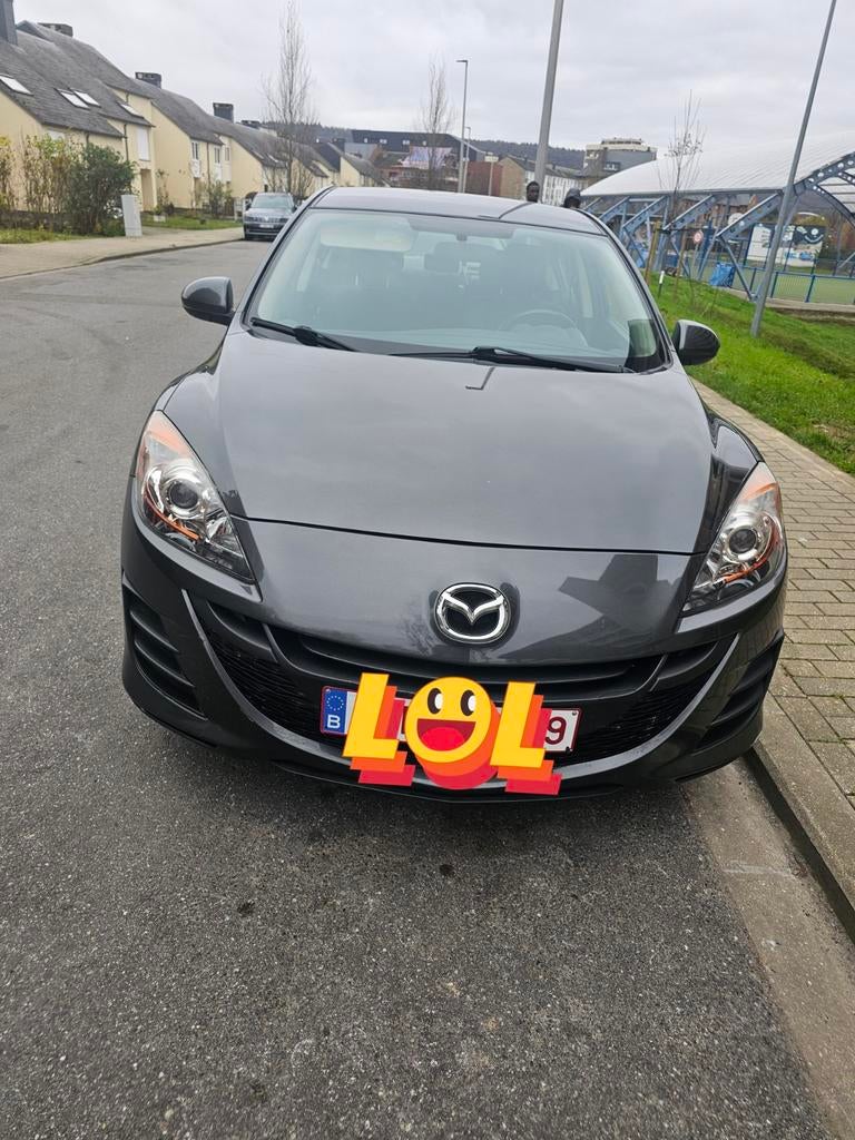 Mazda 3 essence 1.6L 2010, Noir, 5 portes, Particulier, Tissu