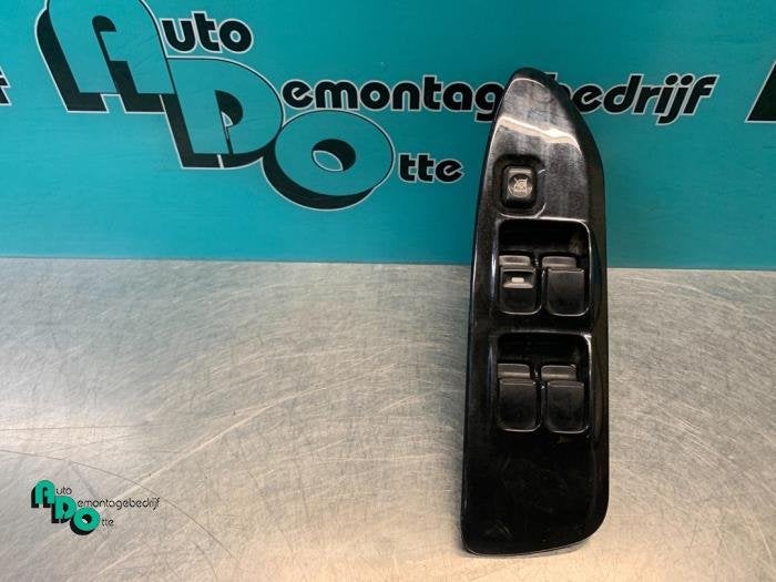 Commutateur vitre électrique d'un Mitsubishi Lancer (Lancer, -, 3 mois de garantie, Utilisé, Mitsubishi