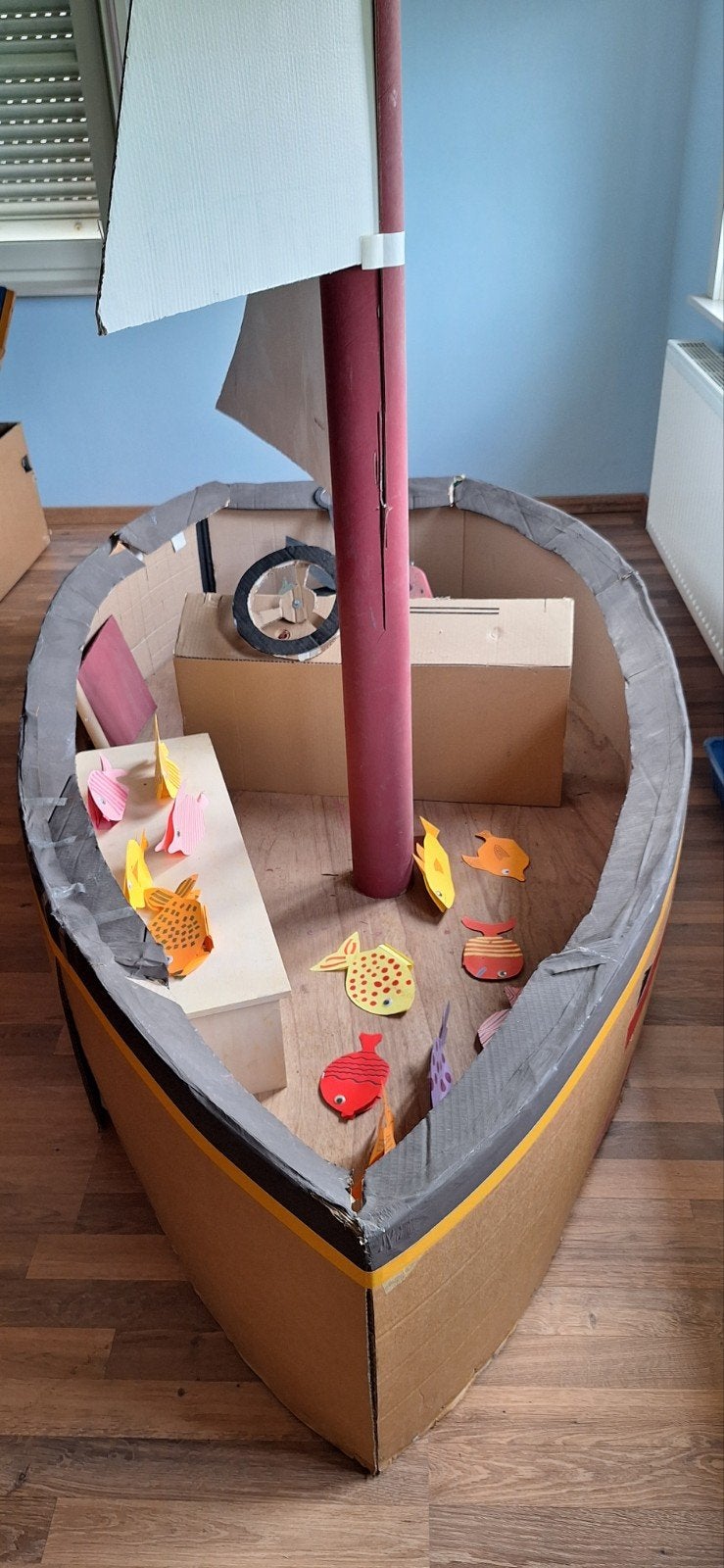 Boot van hout en karton, Ophalen