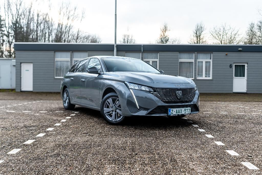 Peugeot 308 SW 1.2i Allure / 22dkm / Nieuwstaat, Auto's, Peugeot, 1199 cc, Leder en Stof, Parkeersensor, Zilver of Grijs