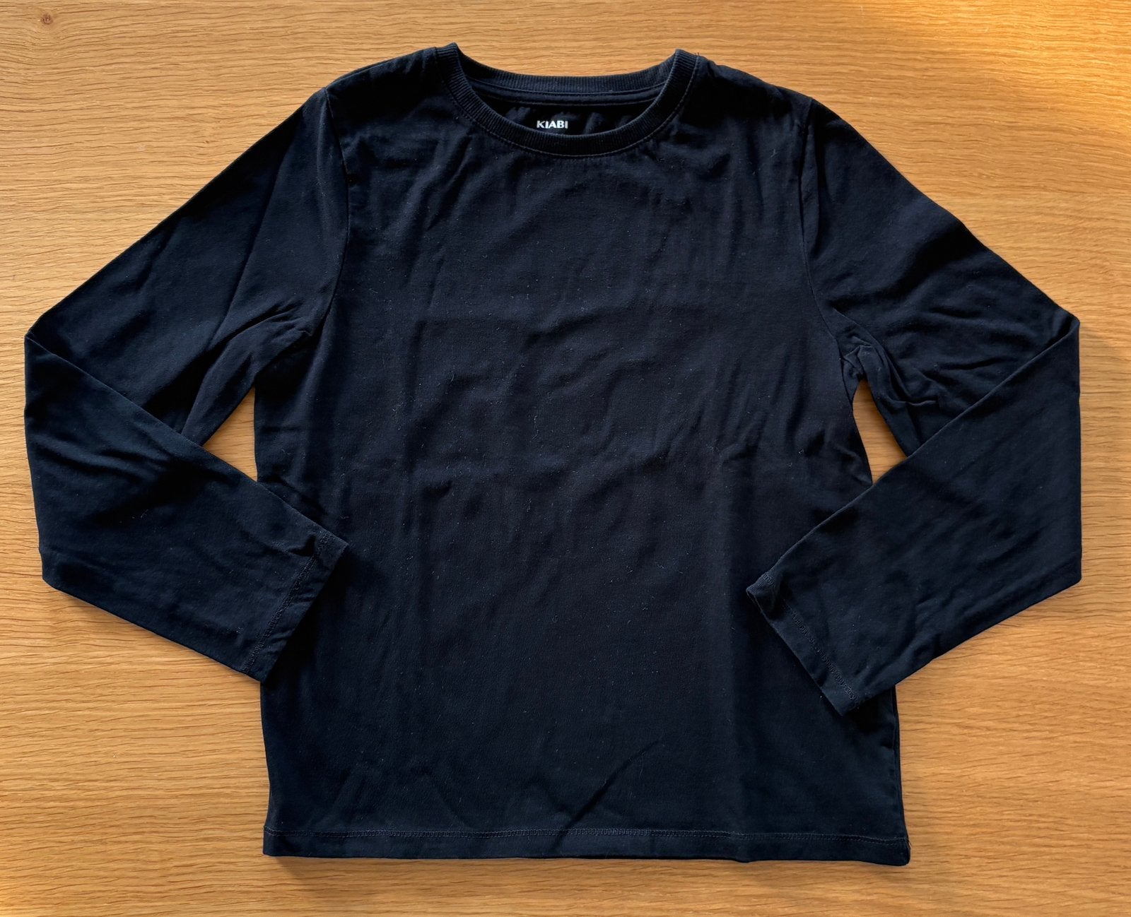 T-shirt noir uni à longues manches  KIABI - 10 ans - 3€, Kinderen en Baby's, Ophalen of Verzenden, Zo goed als nieuw, Jongen