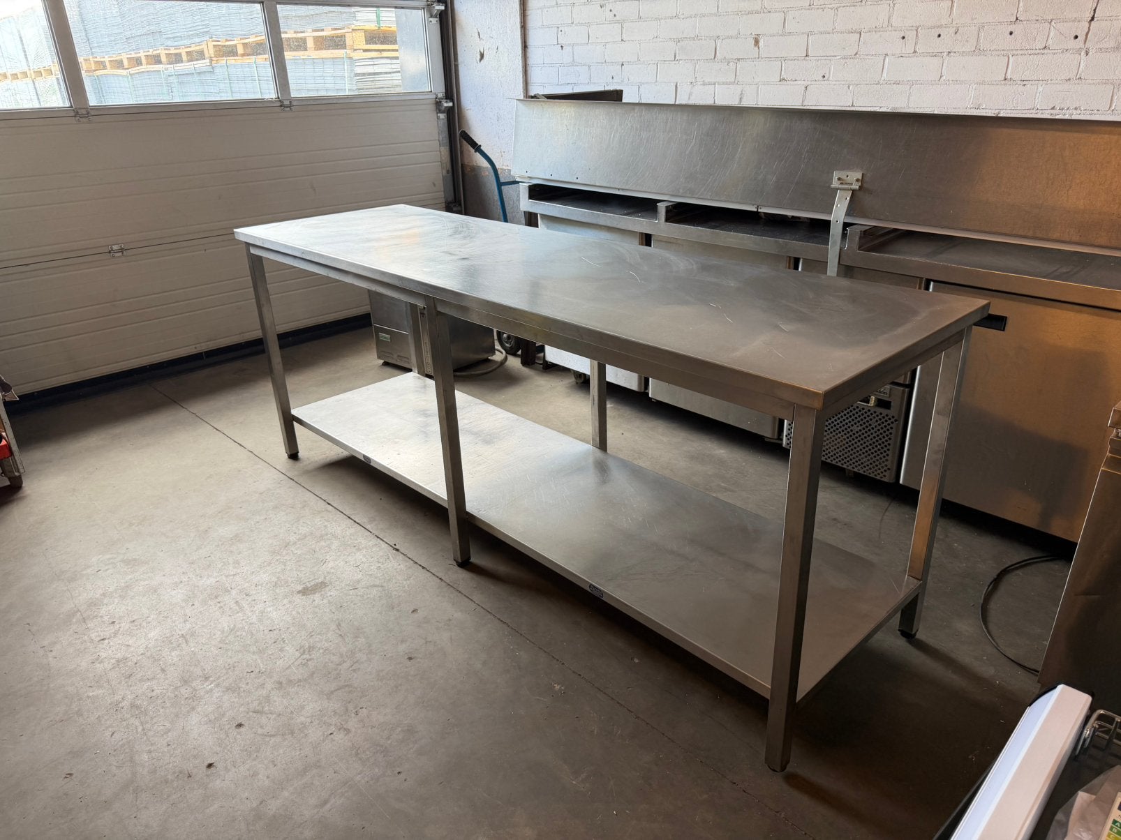 RVS Werktafel / Horeca Tafel 230 x 70 x 90 cm Met Onderplaat, Ophalen, Zo goed als nieuw