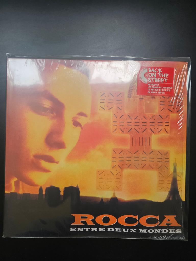 Reissue, Vinyle 2018 : Rocca - Entre deux mondes, Housse de protection extérieure, Enlèvement ou Envoi, Comme neuf