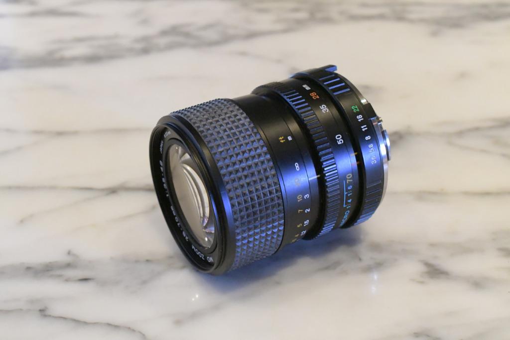Minolta MD 28-70 mm/f/3,5-4,8, Enlèvement ou Envoi, 1980 à nos jours, Lentille ou Lentilles