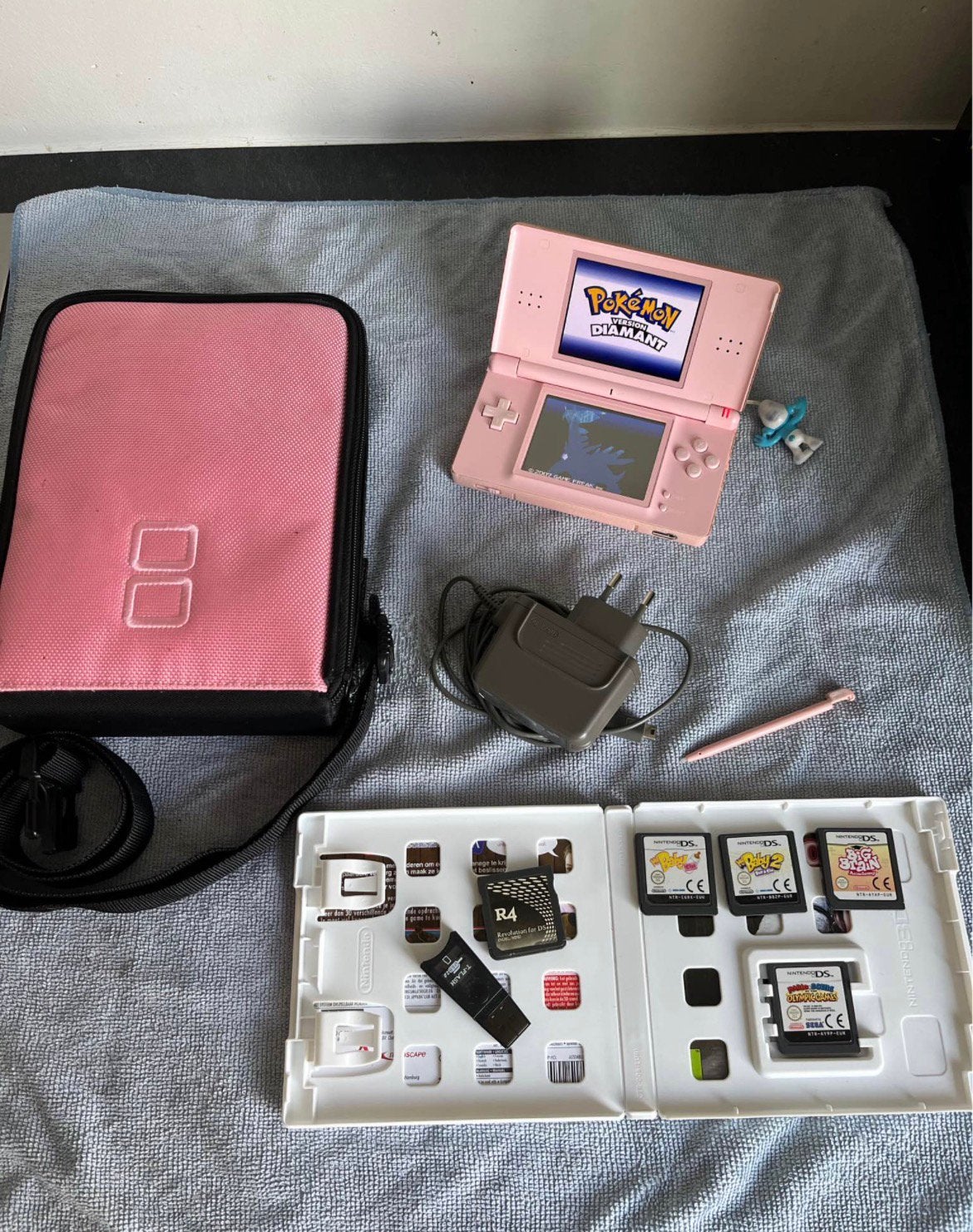 Nintendo ds lite met r4-card met tall van spellen, Games en Spelcomputers, Met games, Ophalen of Verzenden, Zo goed als nieuw
