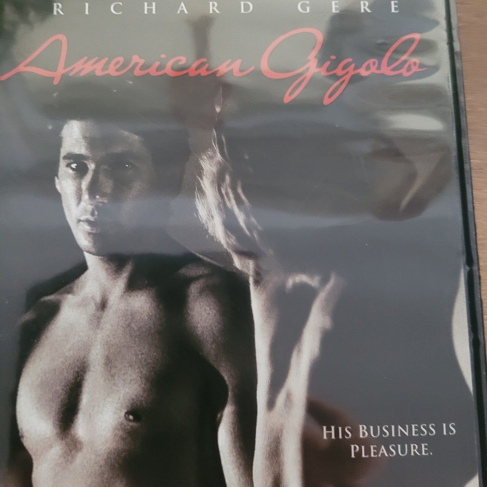 Gigolo américain, Enlèvement ou Envoi, Comme neuf, Anglais, Néerlandais