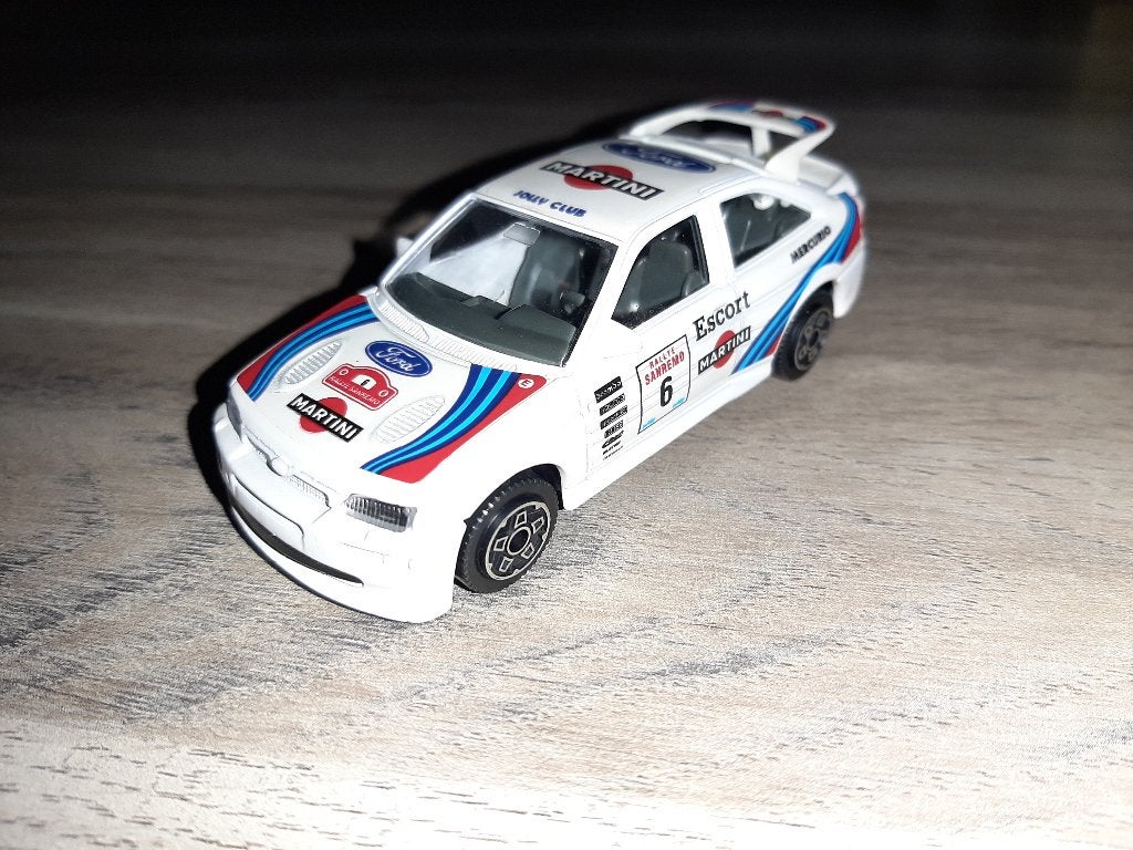 Burago 1/43 Ford Escort Cosworth Martini (nearly mint), Ophalen of Verzenden, Zo goed als nieuw, Auto