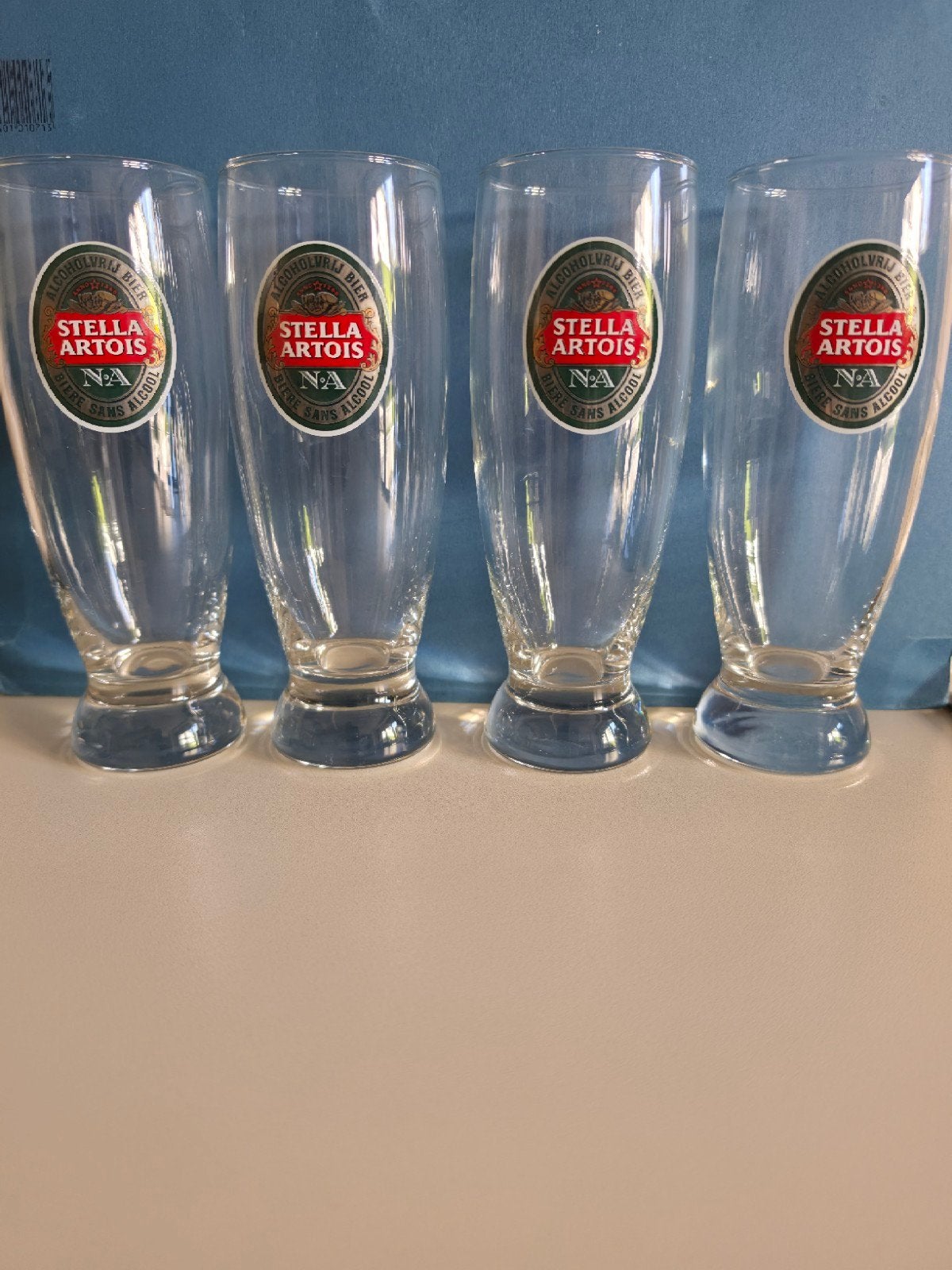 Set van 4 Stella Artois NA (Alcoholvrij) bierglazen, Verzamelen, Ophalen of Verzenden, Zo goed als nieuw, Bierglas