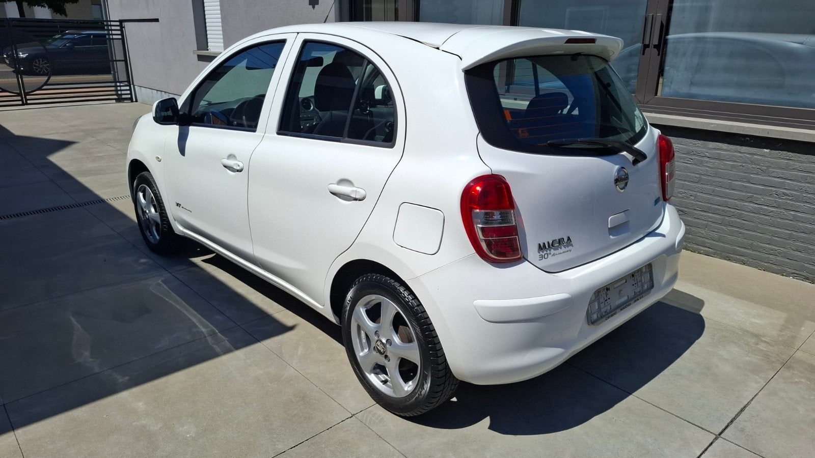 Nissan micra  1.2 benzine 59kw met Airco, Auto's, Voorwielaandrijving, Euro 5, Stof, Zwart