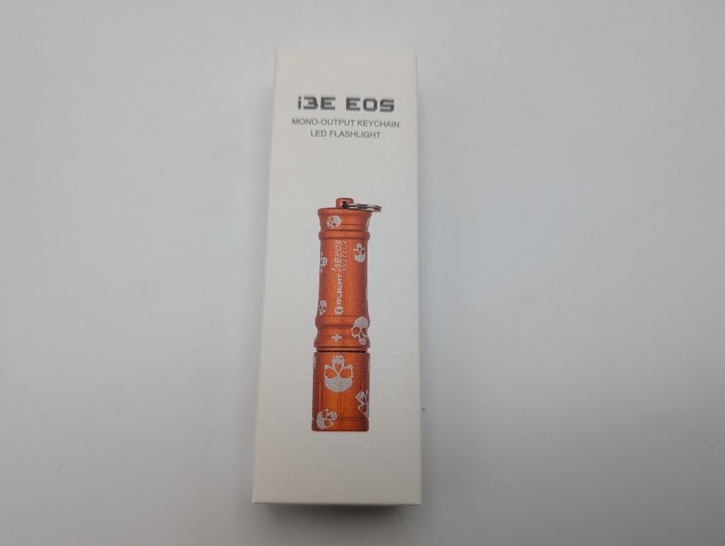 Olight i3E EOS Orange Skull (Limited Edition) - NIEUW, Caravanes & Camping, Lampes de poche, Enlèvement ou Envoi, Neuf, Batterie