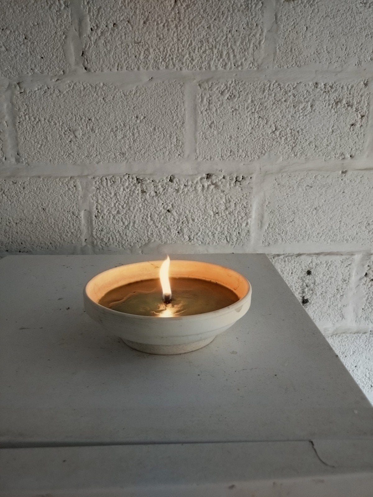 witte terracotta tuinkaarsen, Ophalen