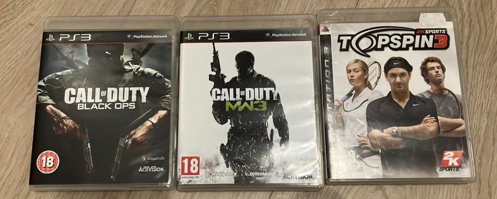 3 PS3 games: COD Modern Warfare 3, COD Blackops, Topspin 3, Enlèvement, Utilisé