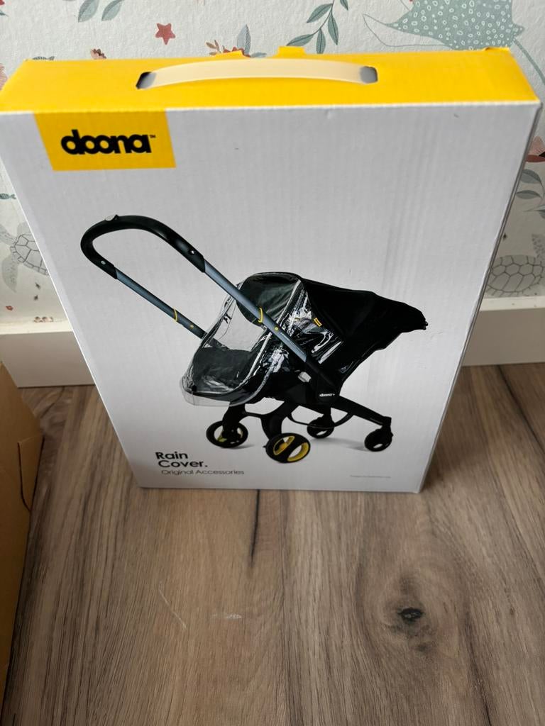 Doona regenhoes nieuw in verpakking, Kinderen en Baby's, Autostoeltjes, Ophalen, Nieuw
