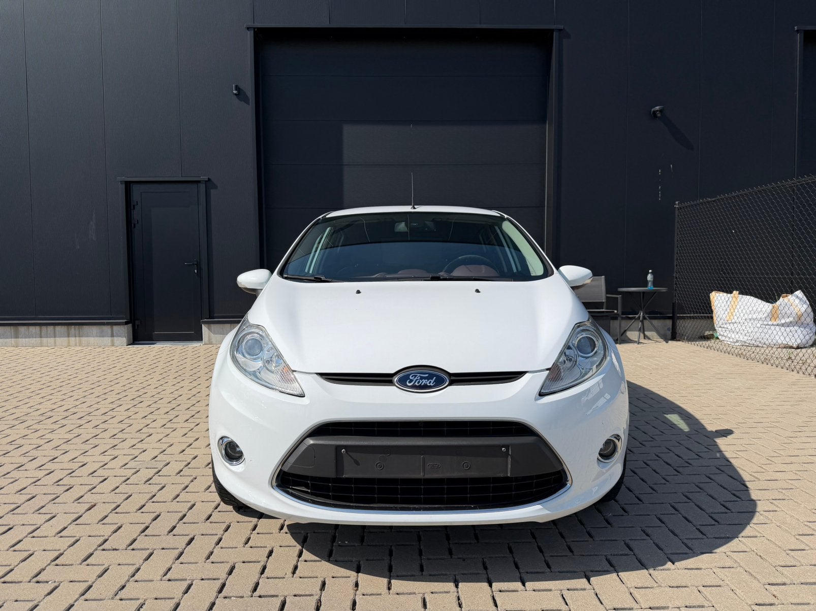 Ford Fiesta 1.25 Benzine - Titanium - Parelmoer wit, Auto's, Ford, Euro 5, Stof, Wit, 5 deurs