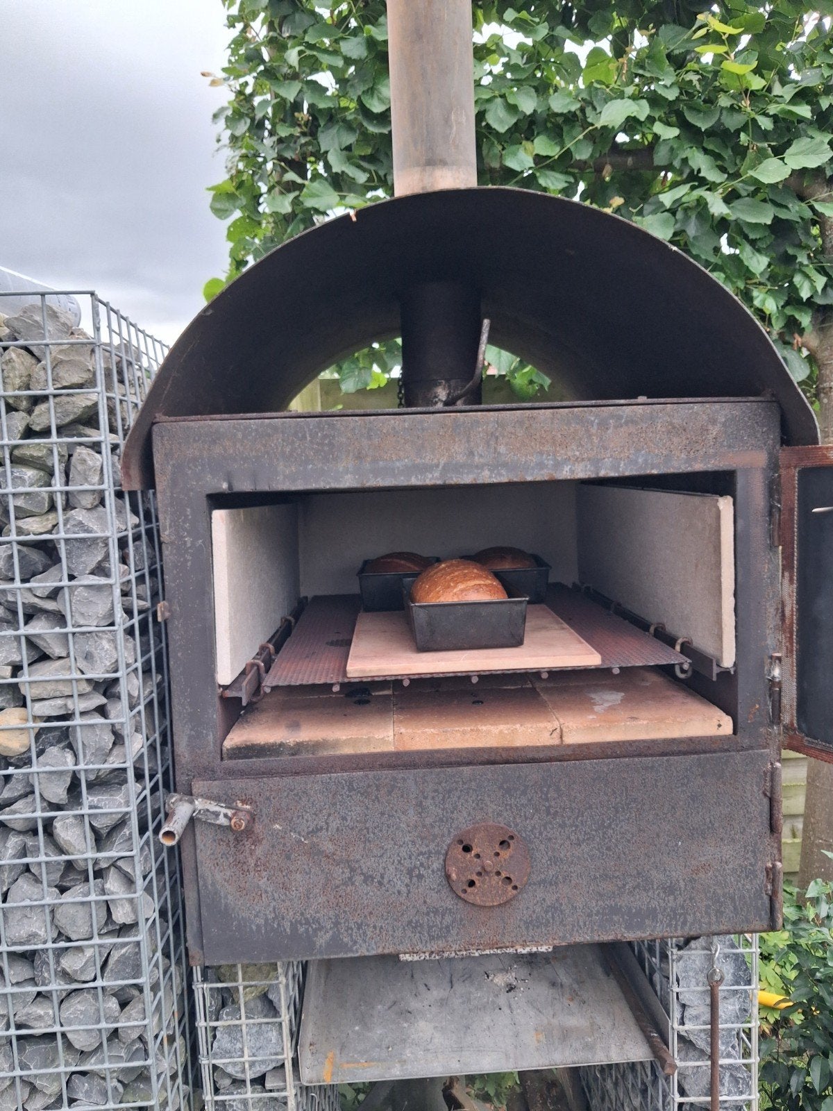 Houtgestookte brood en pizzaoven, Ophalen
