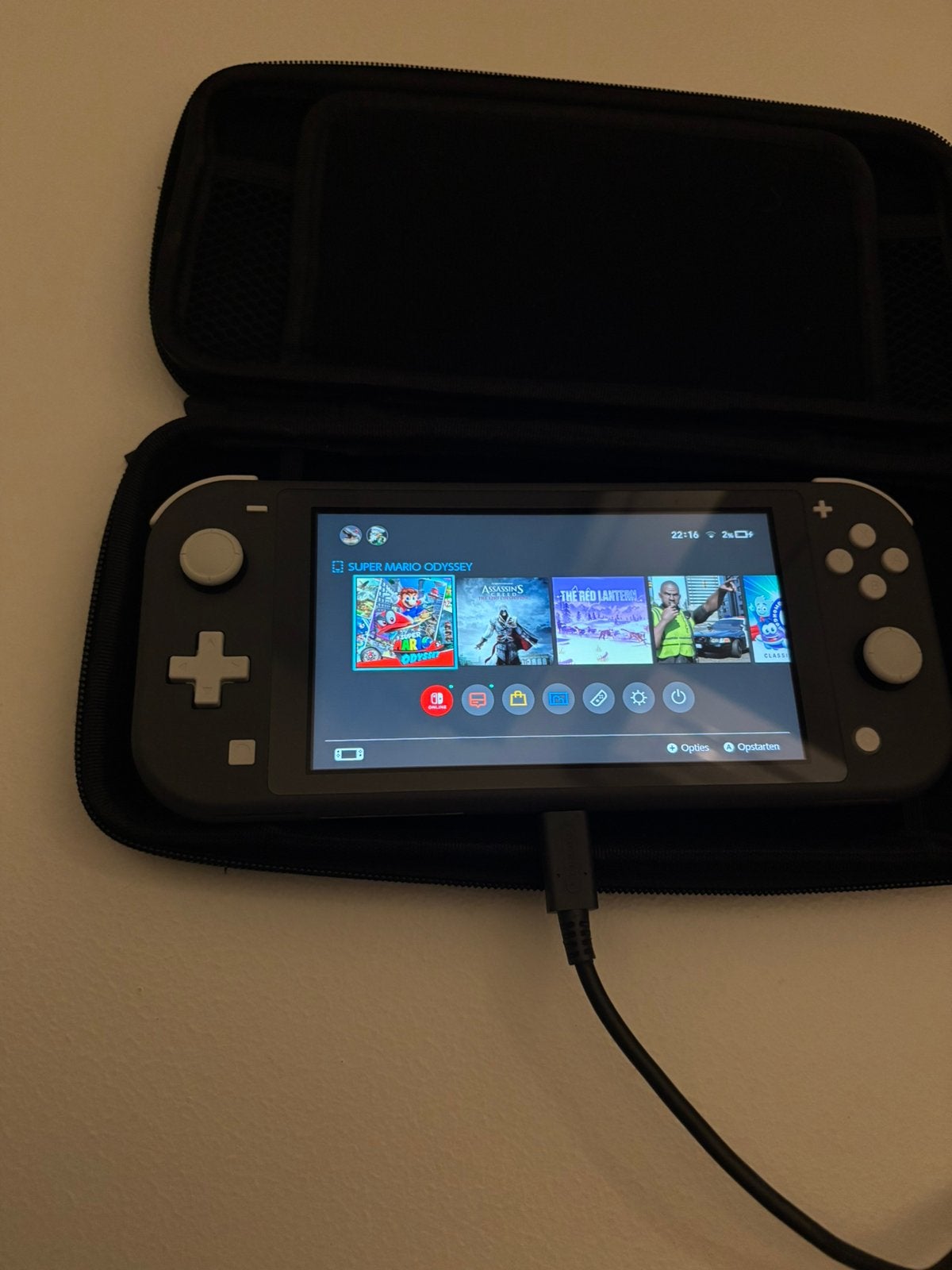 Nintendo Switch Lite + 2 spellen, Enlèvement, Gris, Comme neuf, Avec housse de protection ou sac