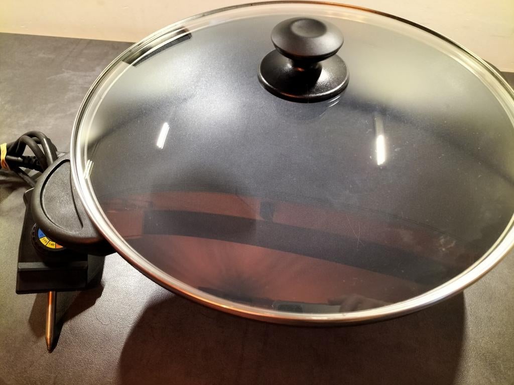 Electrische wokpan met deksel, Enlèvement