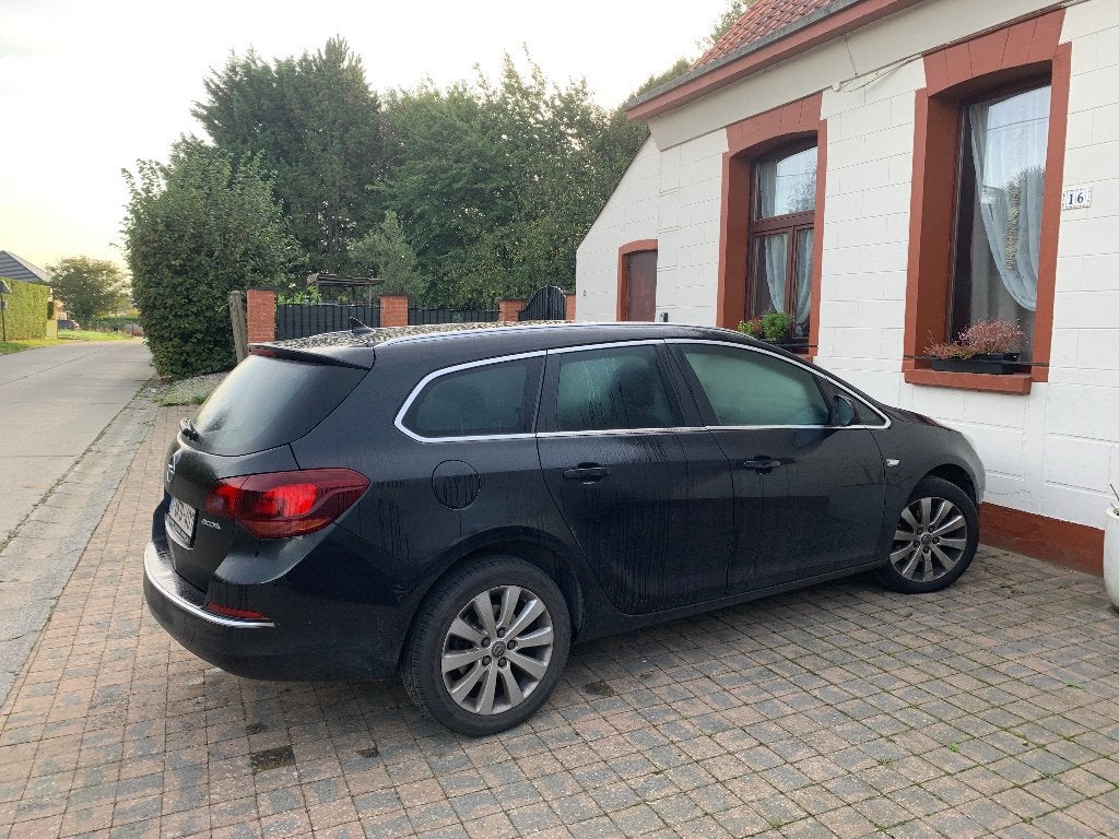 Opel Astra Sports Tourer te koop., Auto's, Euro 6, Zwart, Leder, Bruin