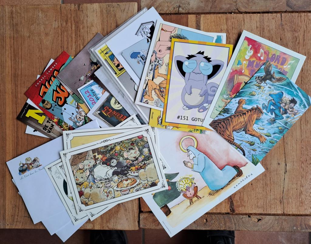Pakketje strip en stripgerelateerde postkaarten, Boeken, Ophalen of Verzenden