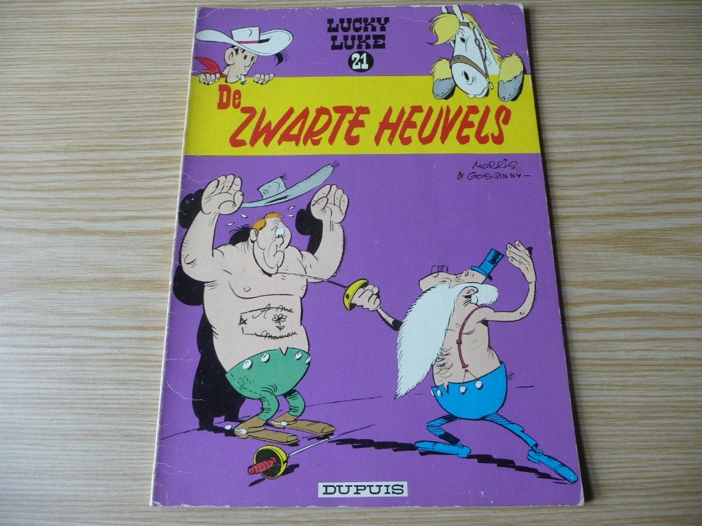 Lucky Luke 21. De zwarte heuvels 1969 €4, Enlèvement ou Envoi, Une BD, Comme neuf, Morris & Goscinny,