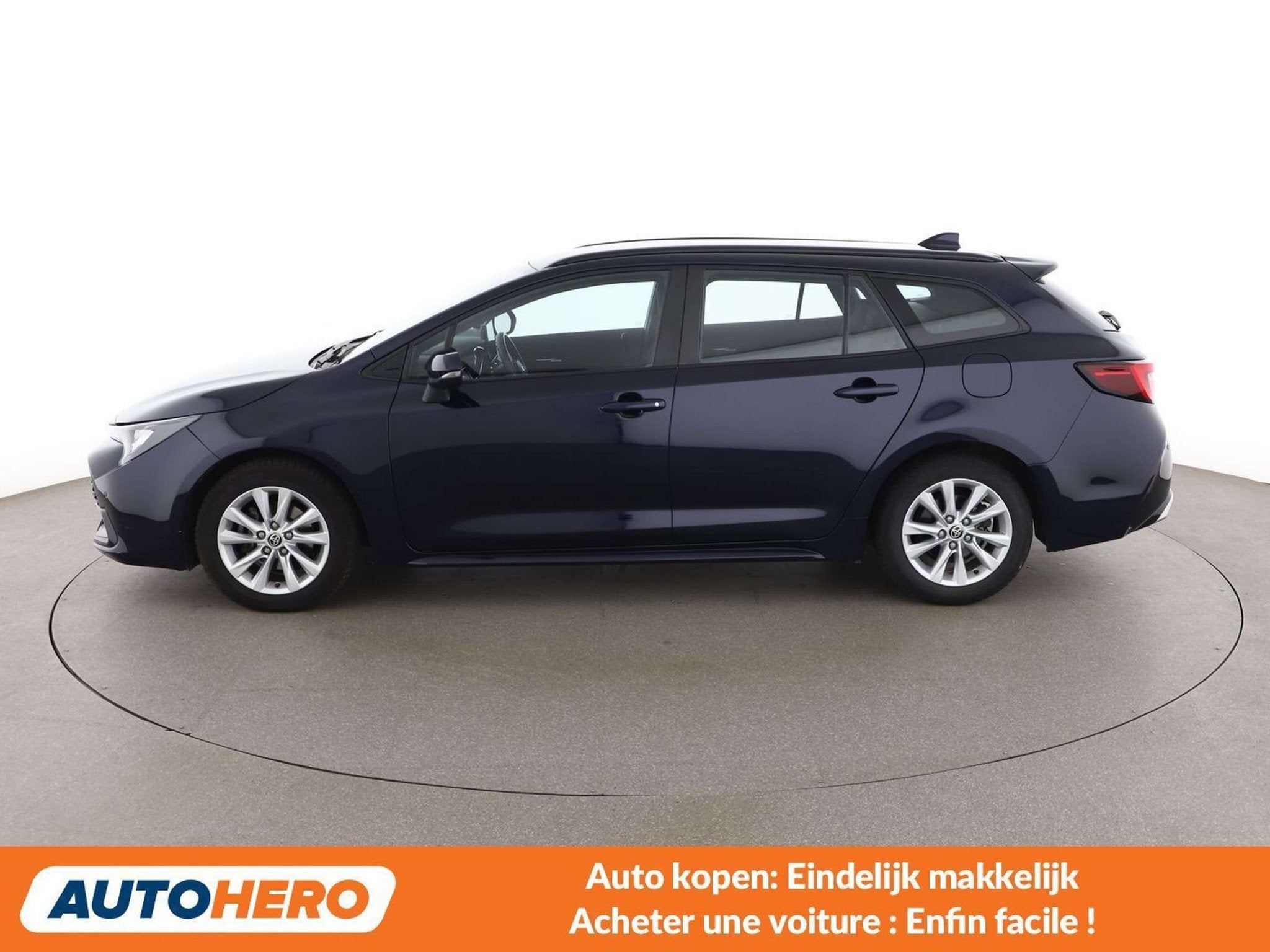 Toyota Corolla 1.8 Hybrid Team D (bj 2023, automaat), Auto's, Stof, Gebruikt, Blauw, Corolla