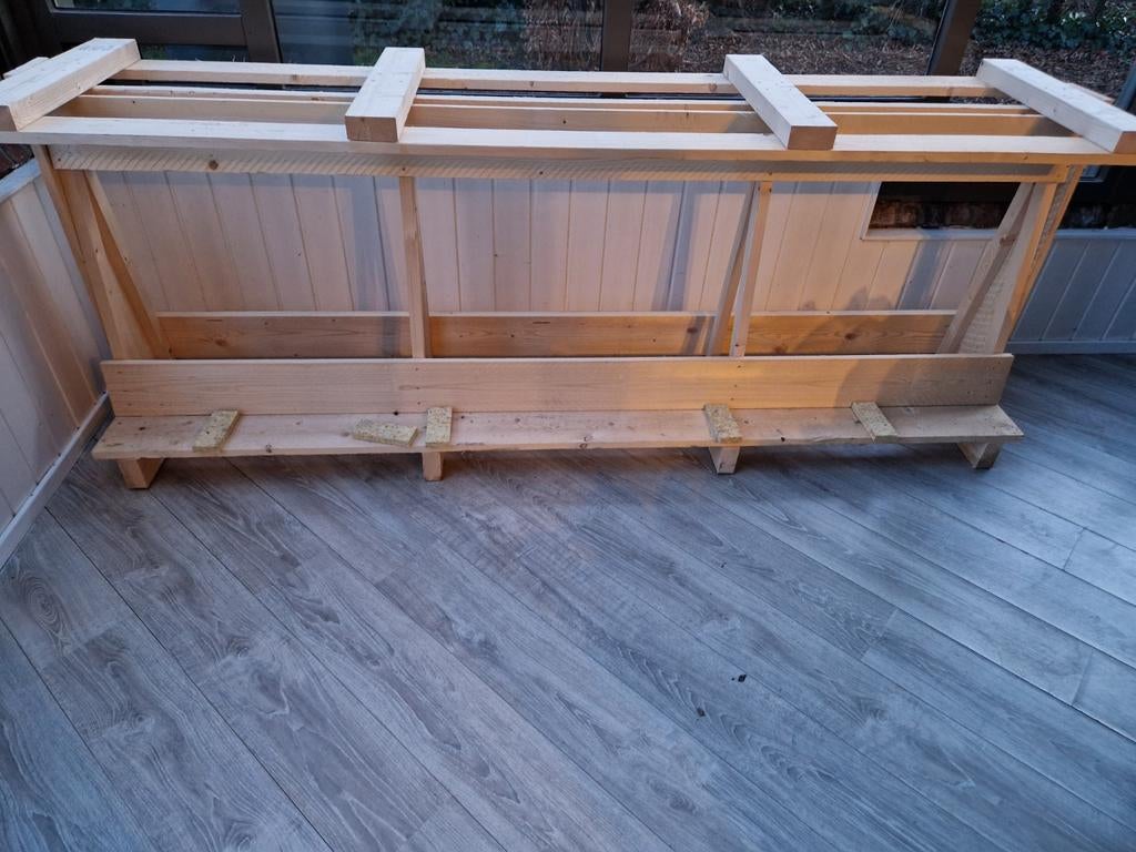 Houten glasbok, Ophalen