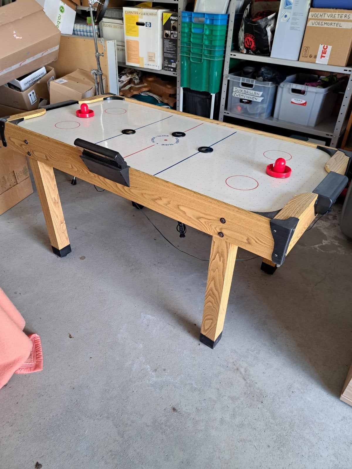 Airhockeytafel, Ophalen