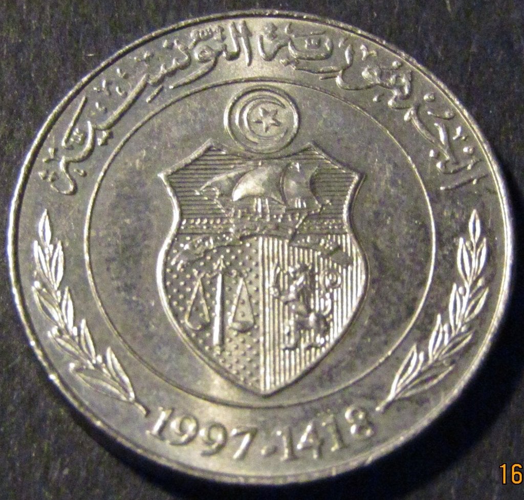Pièce d'un demi-dinar tunisien 1997, Timbres & Monnaies, Monnaies | Afrique, Enlèvement ou Envoi, Autres pays, Monnaie en vrac