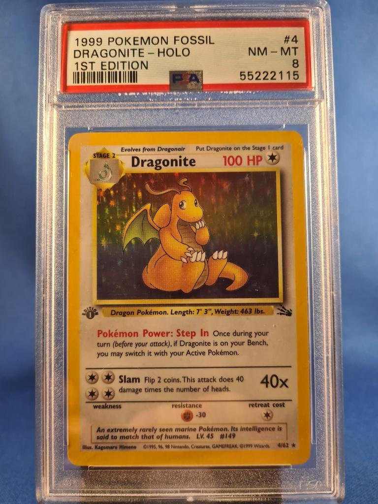Dragonite 4/62 - Fossil (1st edition) (PSA 8), Hobby en Vrije tijd, Verzamelkaartspellen | Pokémon, Gebruikt, Verzenden
