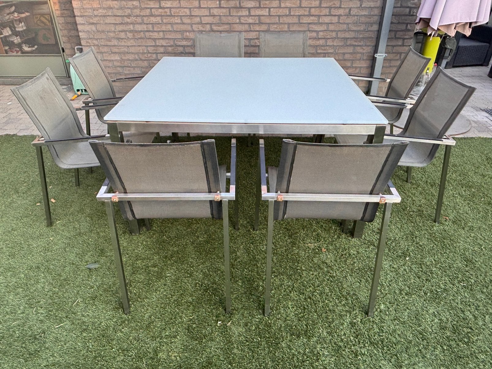 Tuintafel met glazen blad  en 8 stoelen (in RVS), Tuin en Terras, Ophalen, Inox, Gebruikt, 8 zitplaatsen