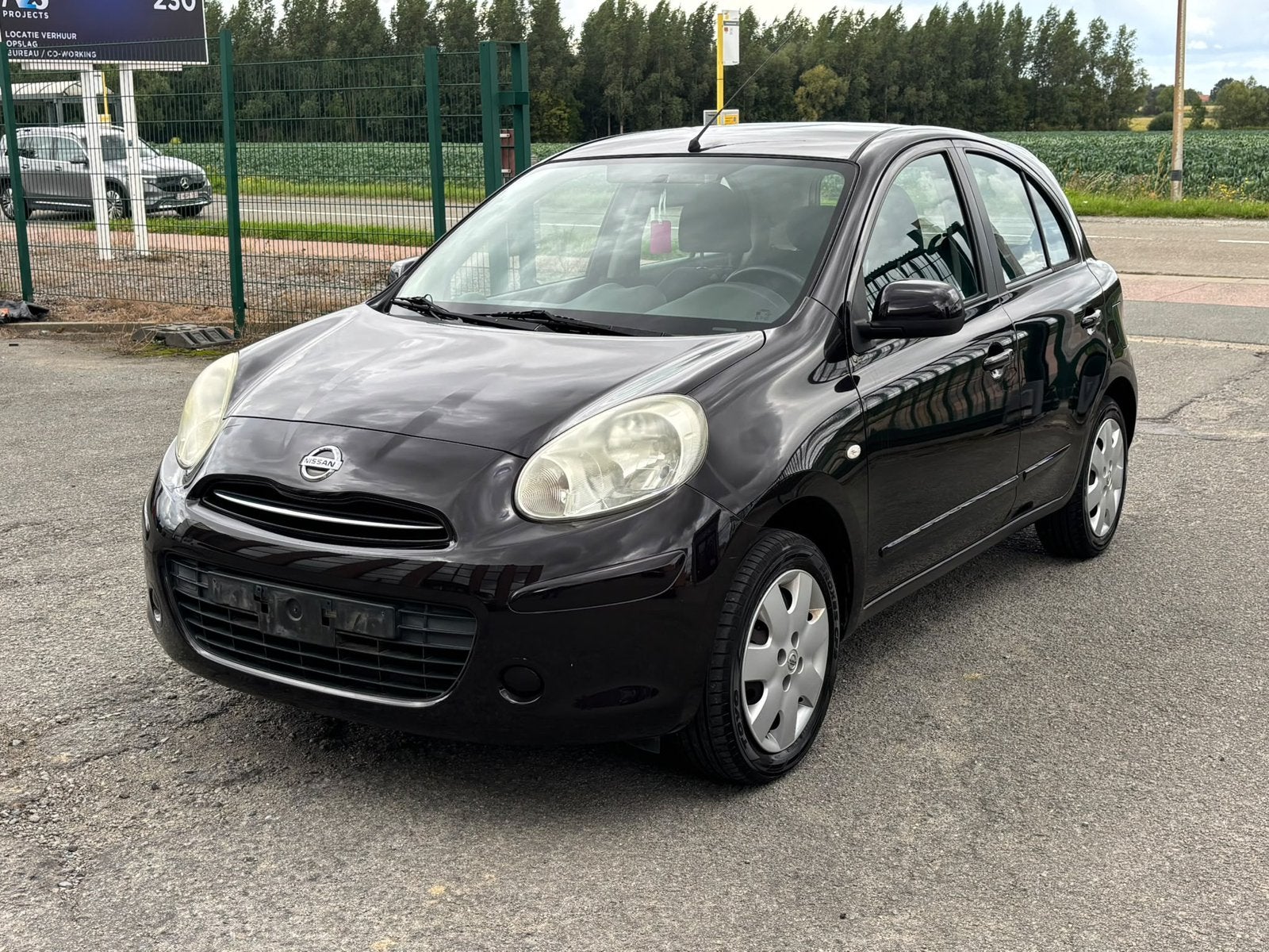 Nissan Micra 1.2 essence airco lez ok, Auto's, https://public.car-pass.be/vhr/ade5ffd6-8dc1-4462-9d00-55495994e9cc, 1198 cc, Zwart