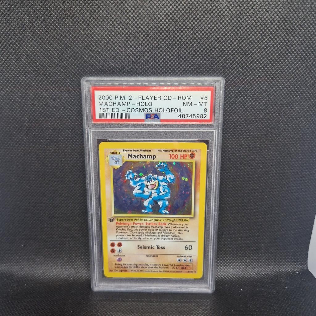 Machamp Holo 1st Edition Cosmos Holofoil PSA 8, Ophalen of Verzenden