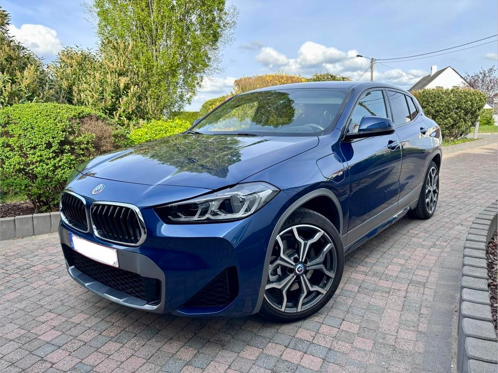 BMW X2 xDrive25e M Sportkit - 01/2023 — Volledige opties, Auto's, Automaat, Parkeerassistent, X2, Blauw
