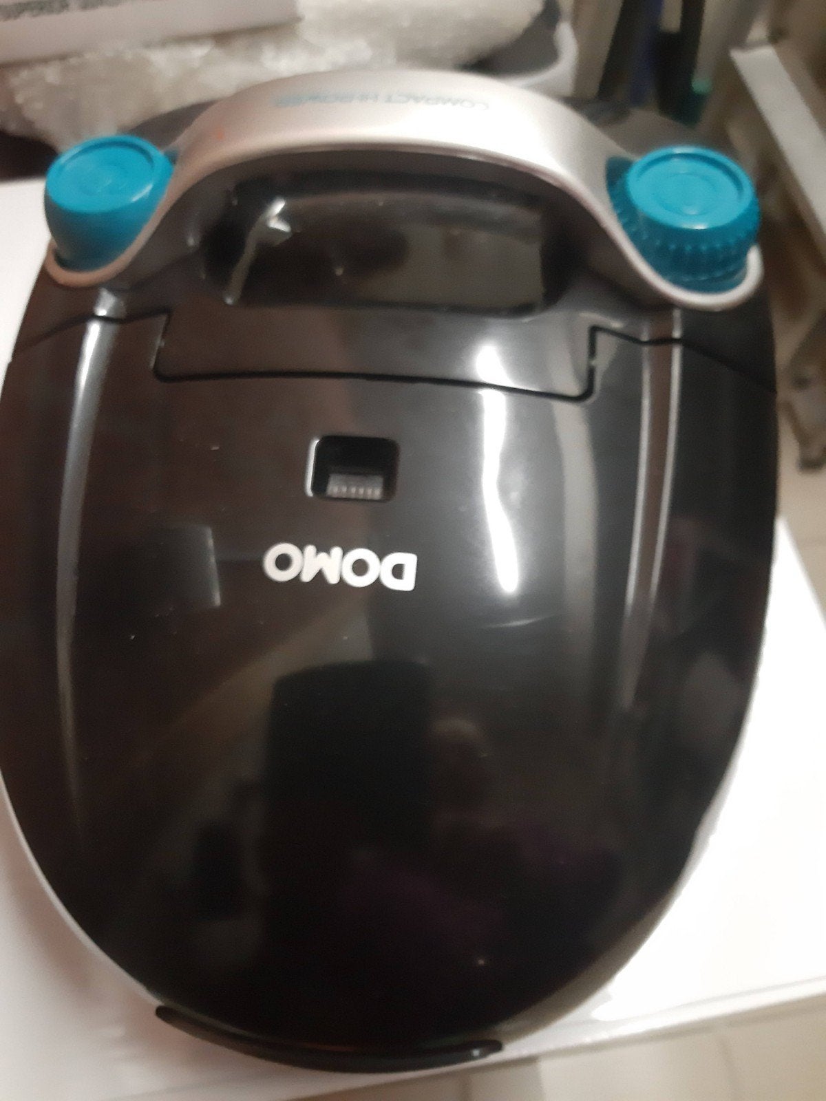 Compacte stofzuiger domo, Ophalen